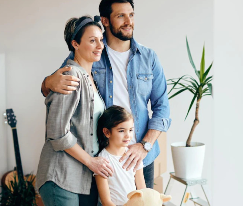 happy-family-looking-through-window-while-moving-into-new-home_637285-11607 1