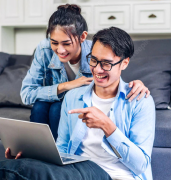 young-asian-couple-relaxing-using-laptop-computer-work-video-conference-meeting-online-chatcreative-business-couple-planning-strategy-analysis-brainstorm-home_38019-2635 1